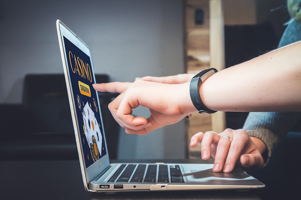 Laptop with online casino web design.